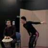 Man playing drum and woman dancing